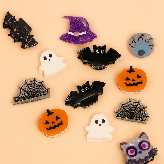 Collection of Halloween-themed hair clips on a beige background