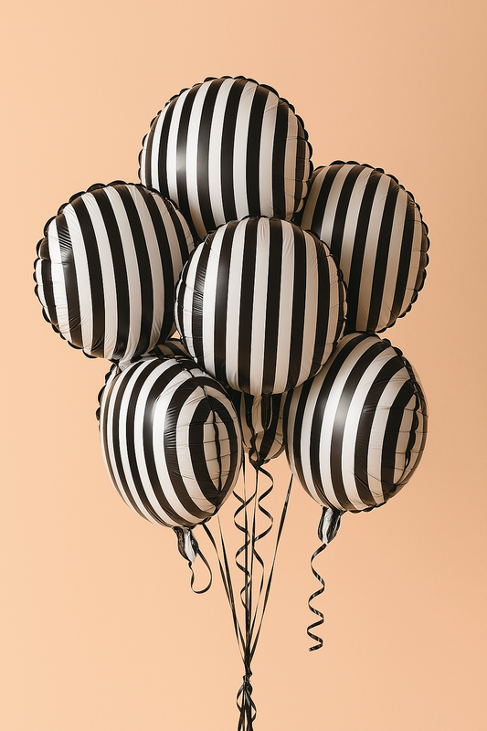Black and white striped balloons on a beige background