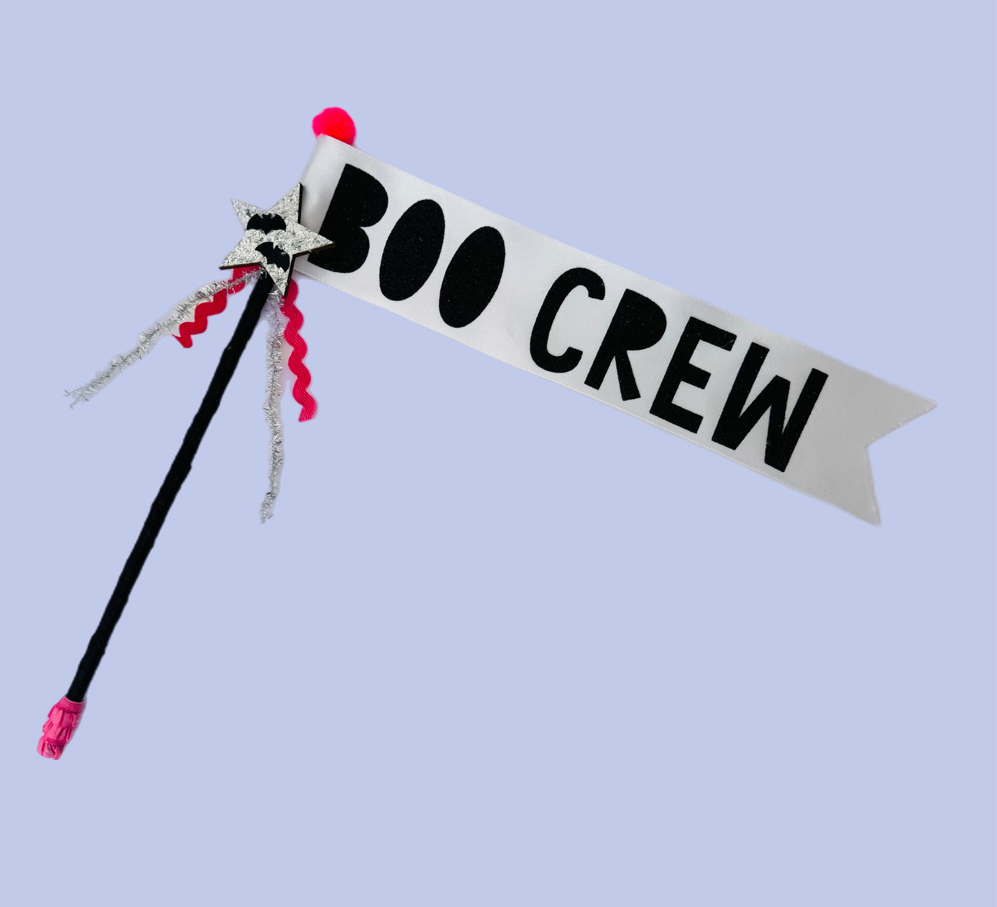 Halloween-themed wand with 'BOO CREW' banner on a light blue background
