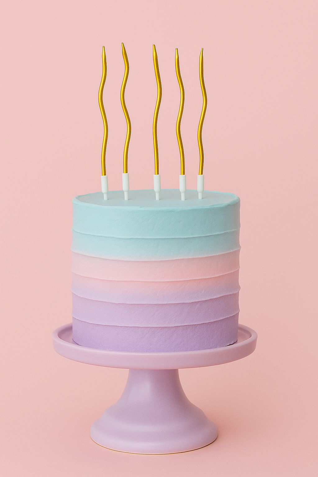 Pastel-colored cake with gold wavy candles on a pink background