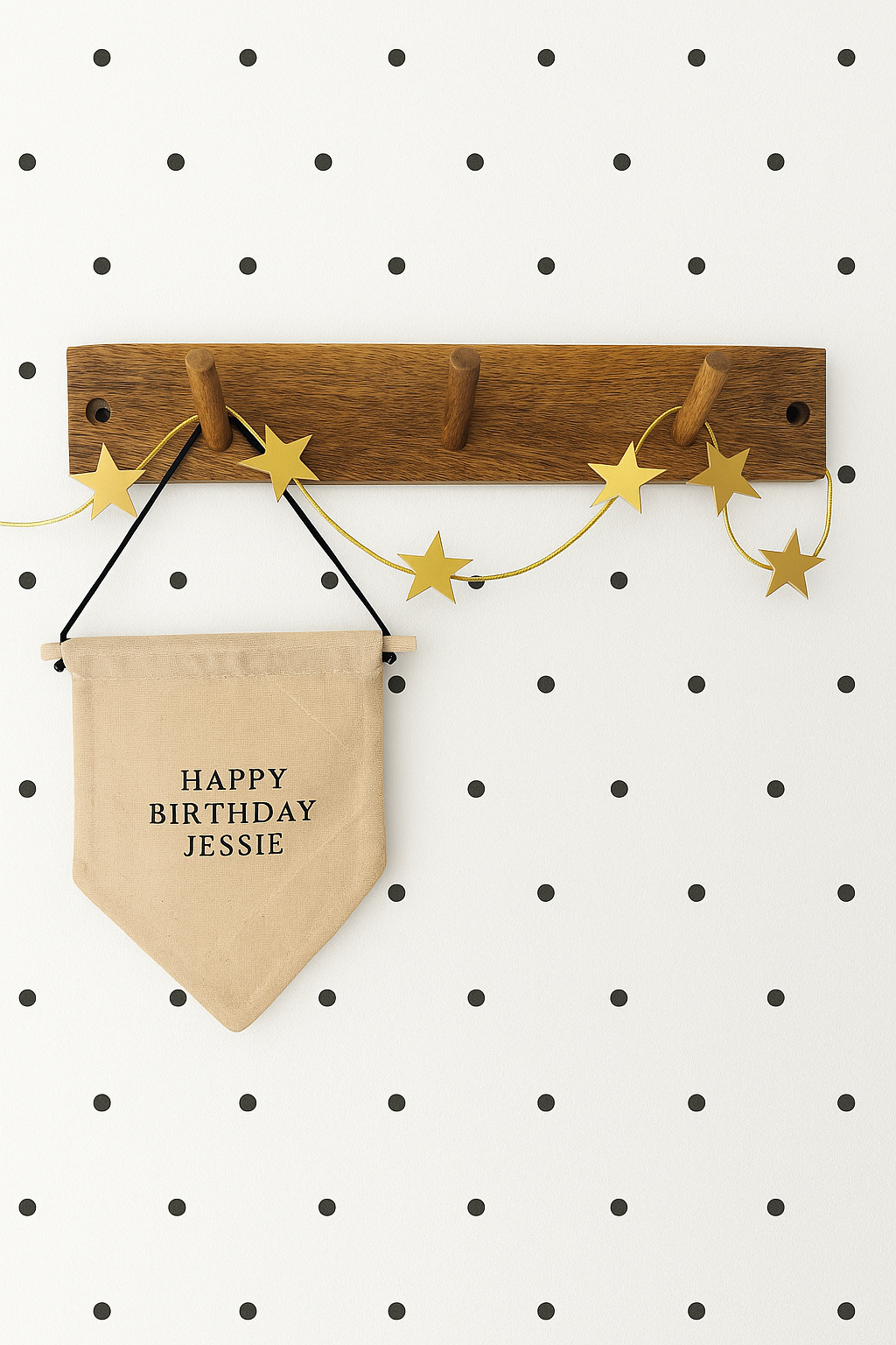 star decorations and a beige happy birthday banner on a polka dot background