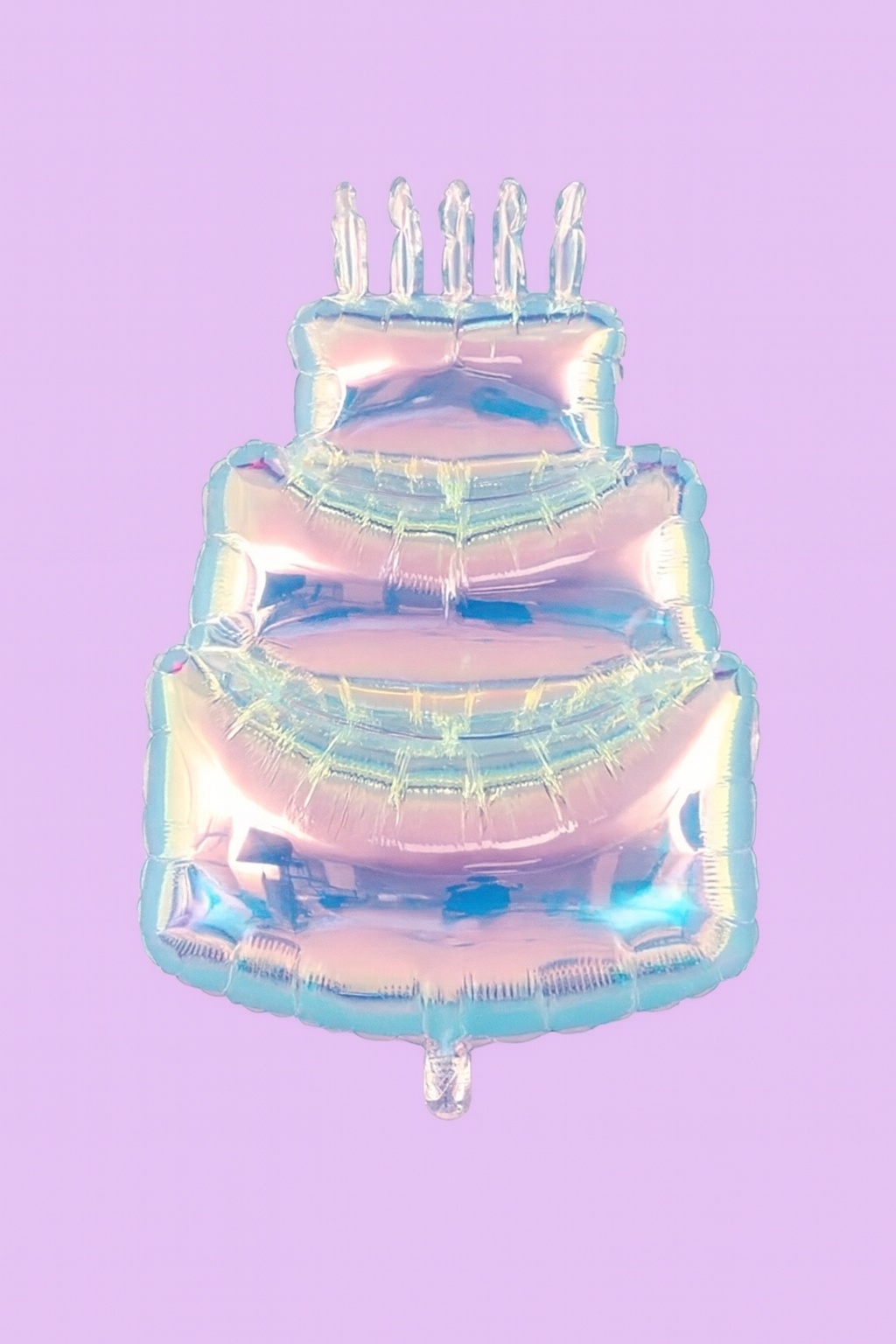Iridescent birthday cake-shaped balloon with candles on a purple background