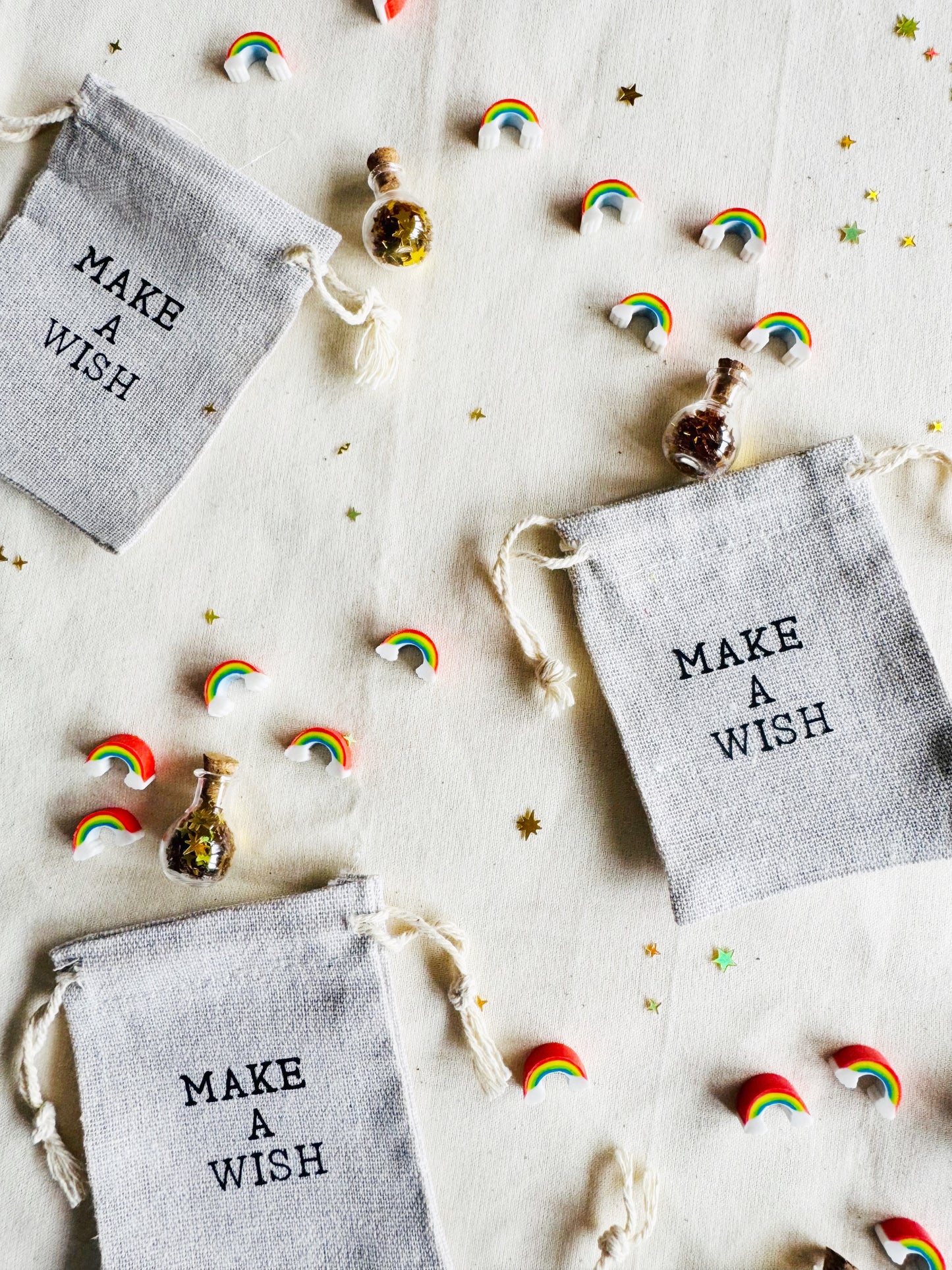 Small bags labeled 'Make a Wish' with decorative elements on a light background