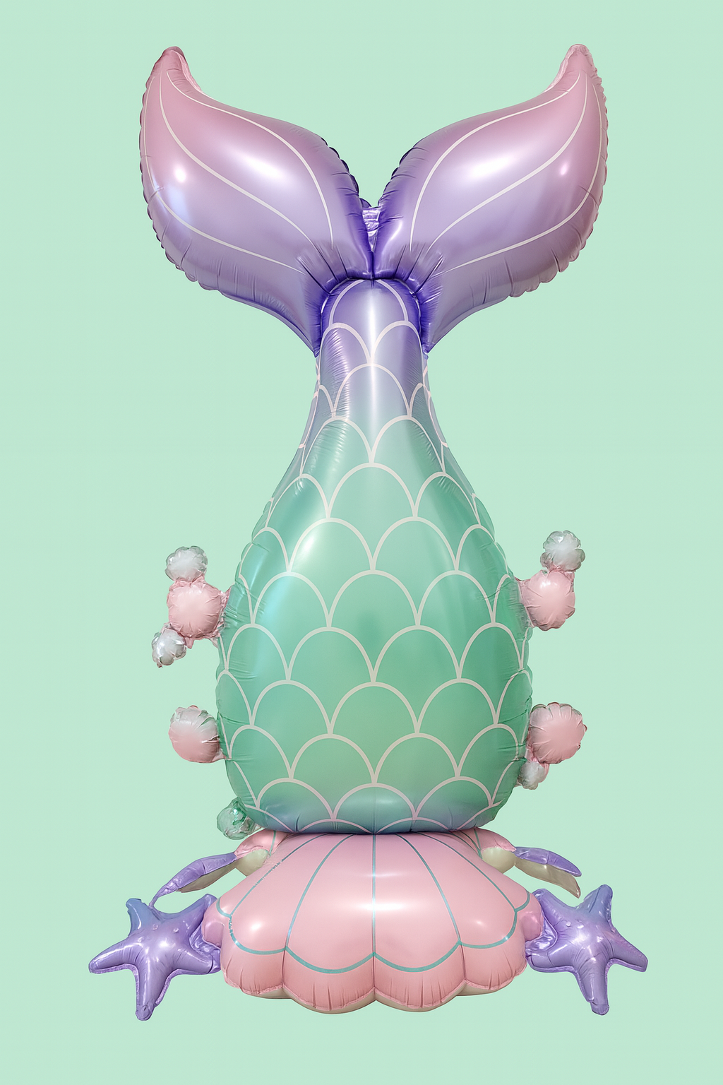 Inflatable mermaid tail balloon on a light green background