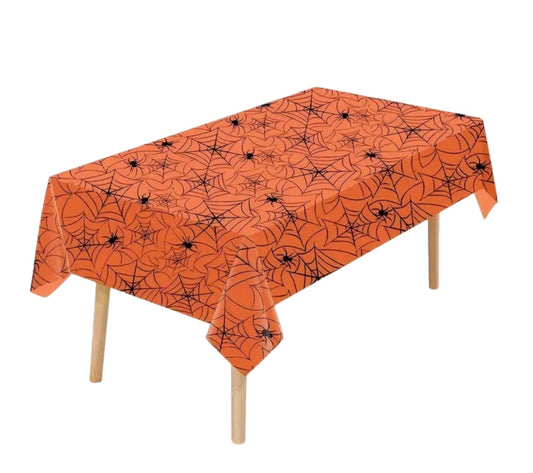Orange Halloween tablecloth with black spider webs and spiders on a white background