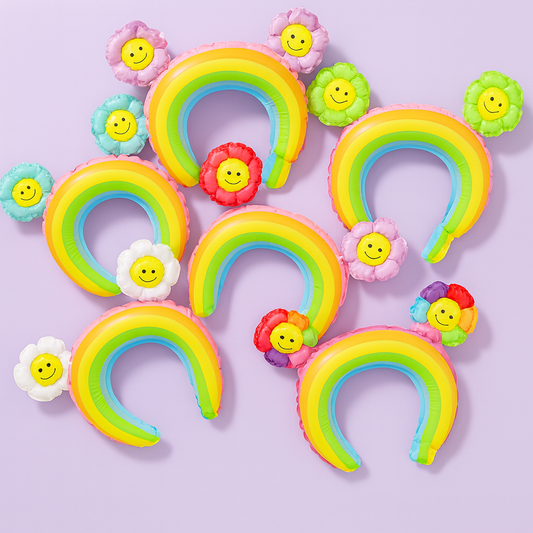 Colorful rainbow-shaped headbands with smiley face flowers on a light purple background