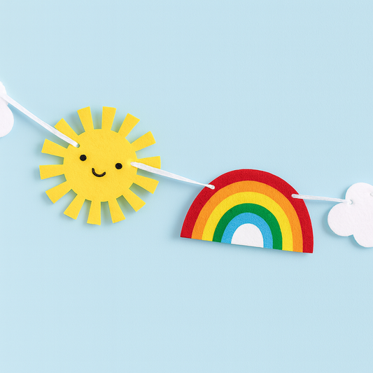 Decorative banner with sun, rainbow, and cloud on a light blue background