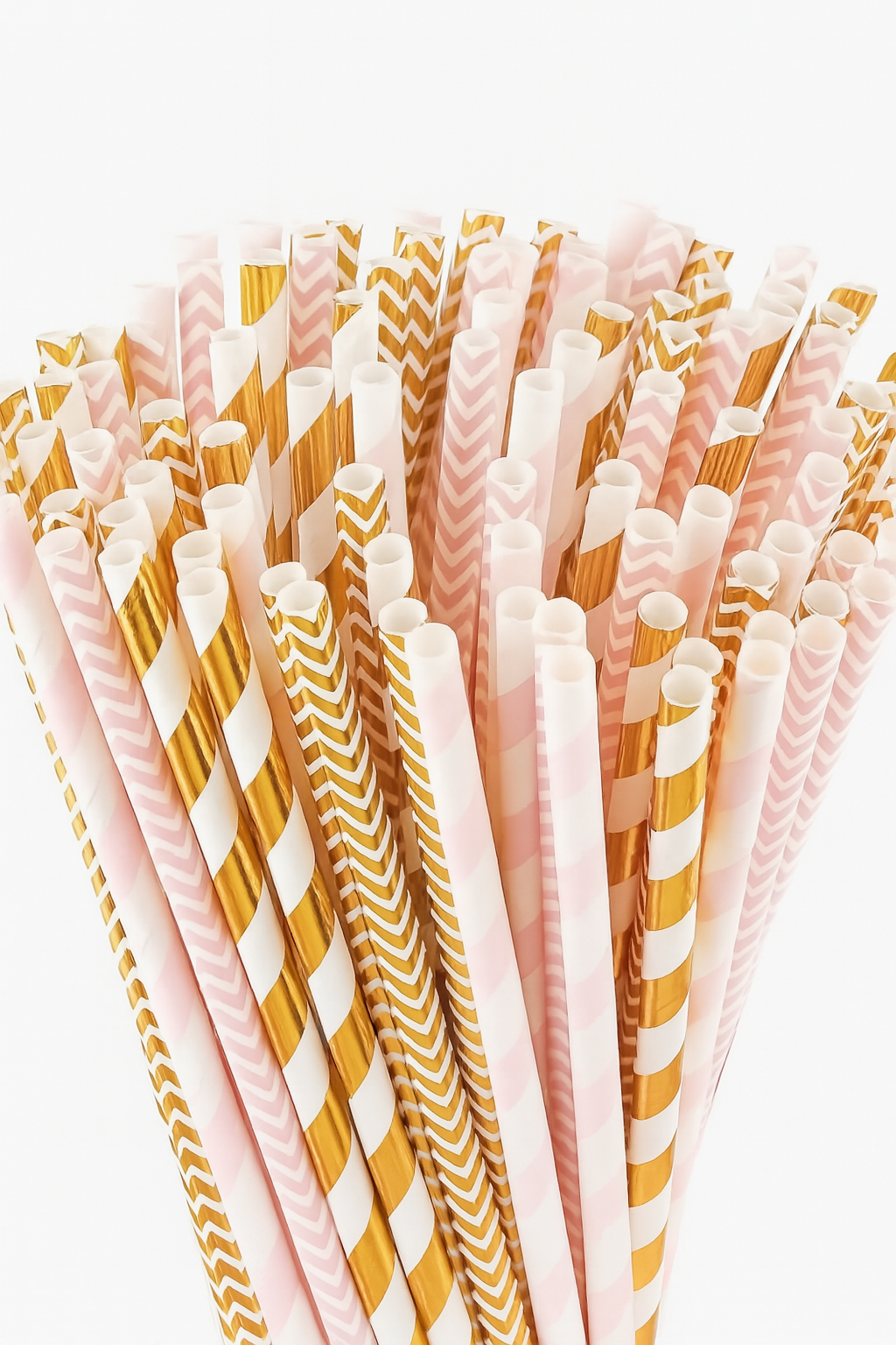 Set of colorful paper straws with patterns on a white background