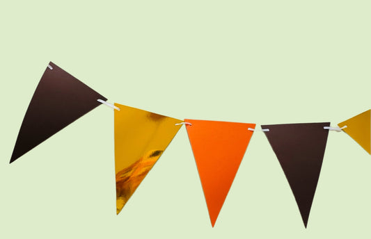 Autumn tones triangle-shaped bunting flags on a light green background