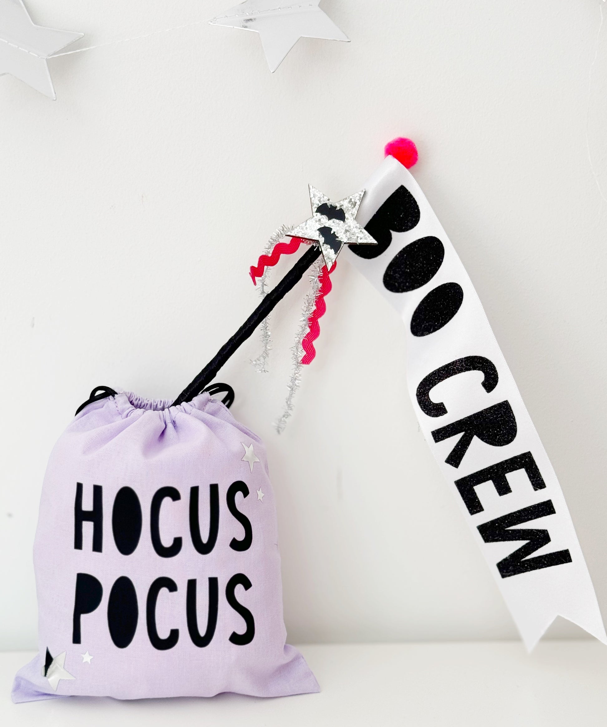 Halloween-themed bag and flag wand with 'Hocus Pocus' and 'Boo Crew' text on a white background.