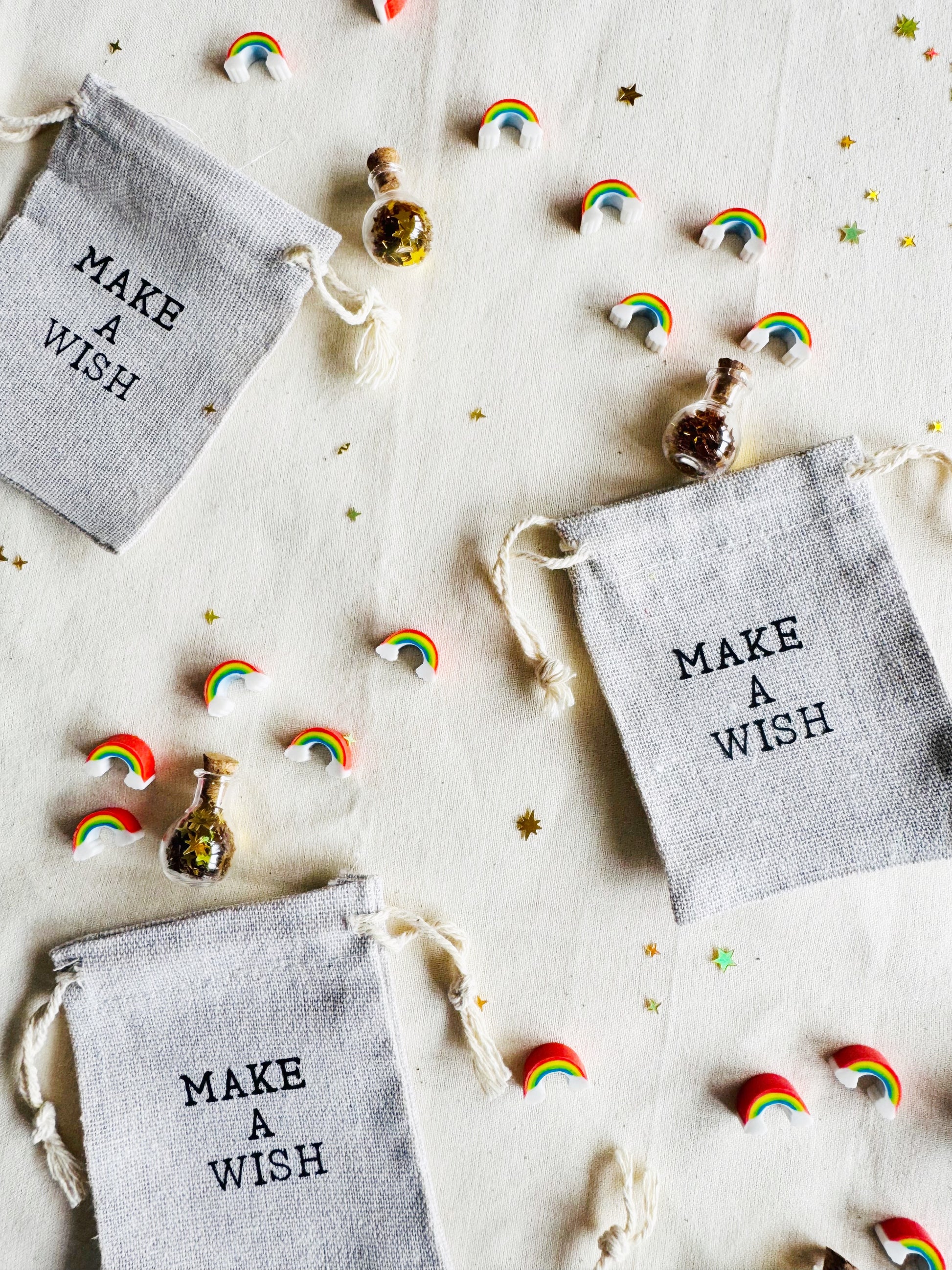 Small bags labeled 'Make a Wish' with decorative elements on a light background