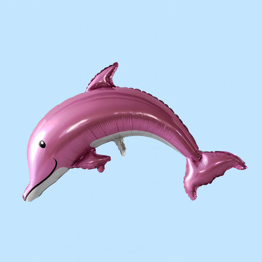 Pink dolphin-shaped balloon against a light blue background