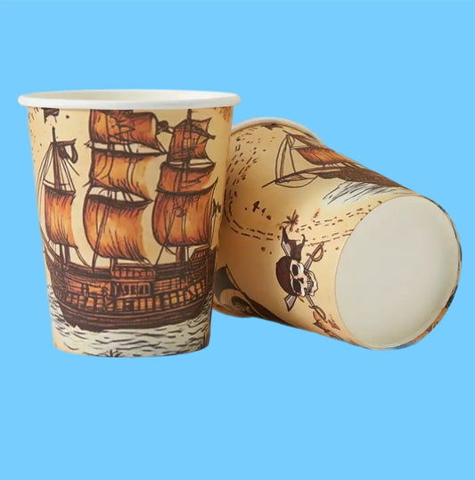 Illustrated pirate themed party paper cups on blue background 