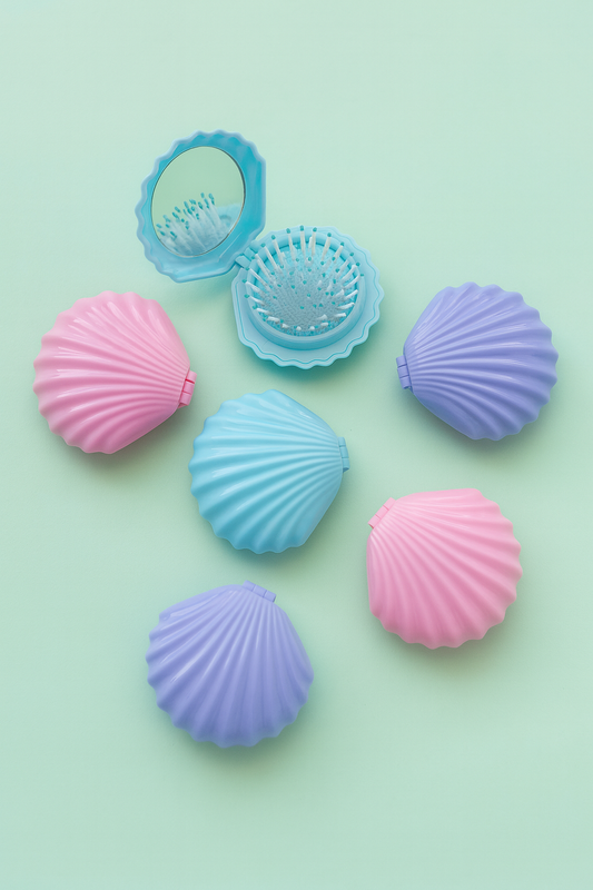 Colourful shell-shaped bath bombs on a light green background