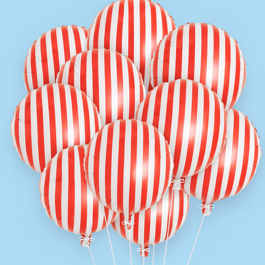 Red and white striped balloons against a light blue background