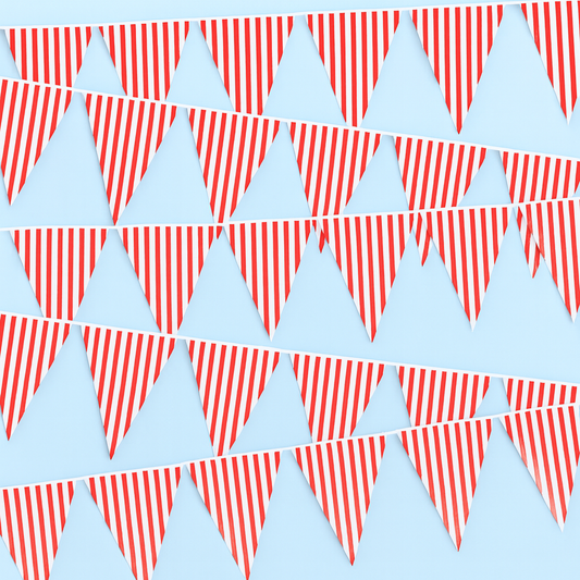 Red and white striped bunting flags on a light blue background